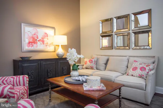 a living room with furniture flowerpot and window