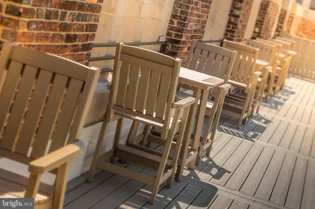 a living room with a bed furniture and a window