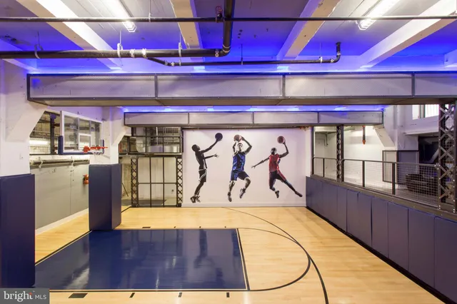 a kitchen with stainless steel appliances granite countertop a stove a microwave and a refrigerator