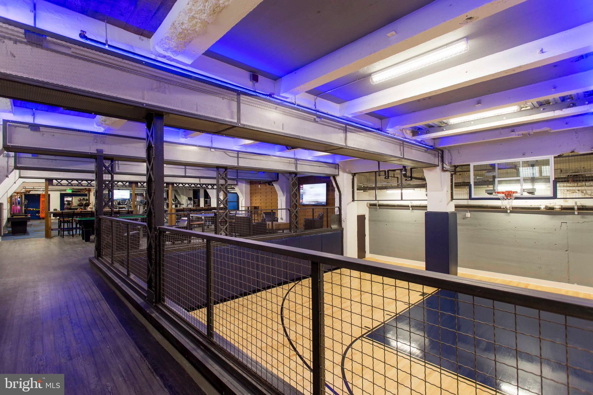 26 South Calvert Street, Unit 2BR Baltimore, MD 21202 - Photo 35 of 83 a view of a room with lots of wooden furniture and a kitchen