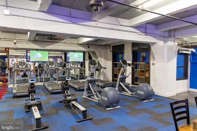 a kitchen with stainless steel appliances granite countertop a stove microwave and cabinets