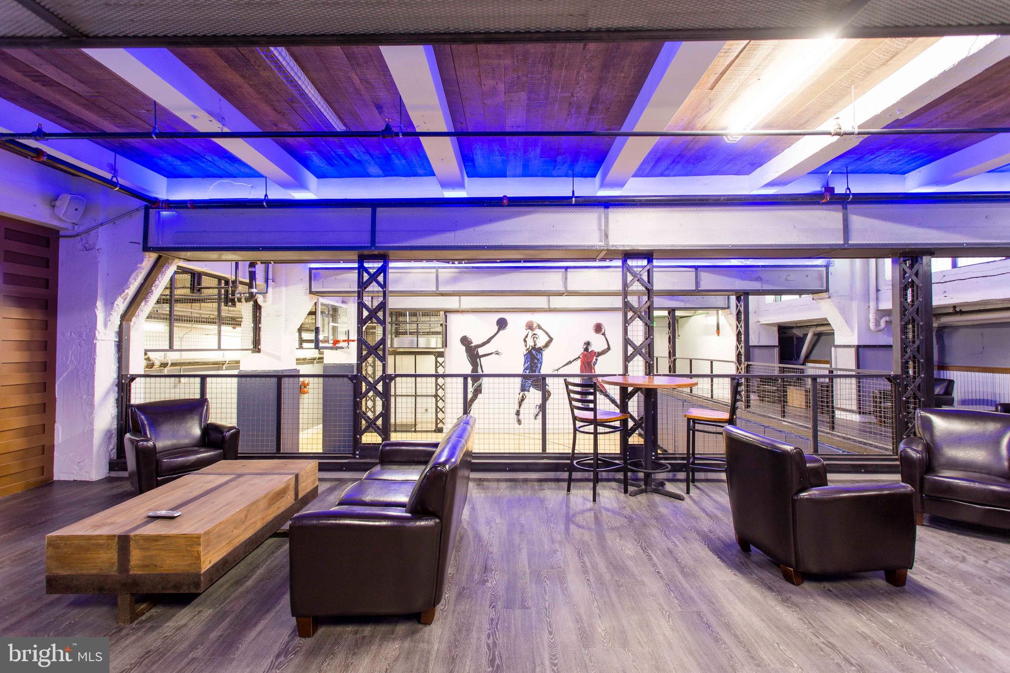 26 South Calvert Street, Unit 2BR Baltimore, MD 21202 - Photo 48 of 83 a living room with furniture and wooden floor