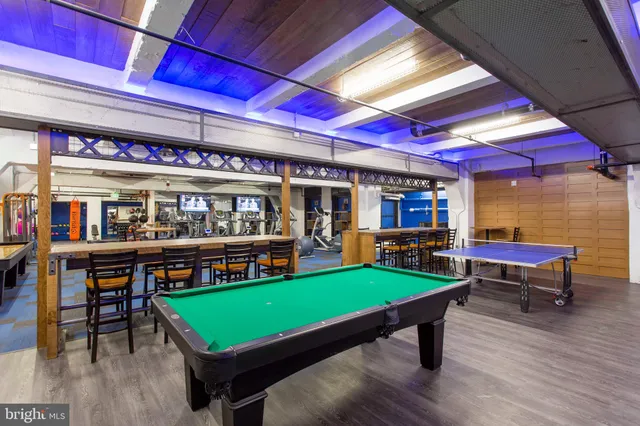 a bedroom with a bed and a potted plant