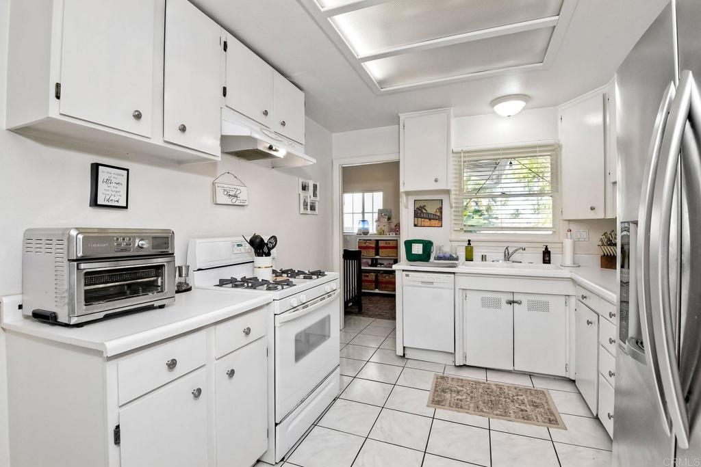 1328 Pine Avenue Carlsbad, CA 92008 - Photo 11 of 48 a kitchen with cabinets and appliances