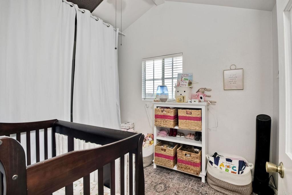 1328 Pine Avenue Carlsbad, CA 92008 - Photo 14 of 48 a bedroom with furniture and a window