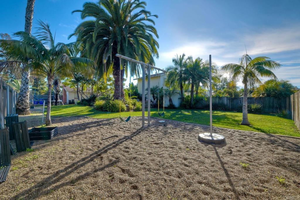 1328 Pine Avenue Carlsbad, CA 92008 - Photo 23 of 48 a view of a yard with palm trees