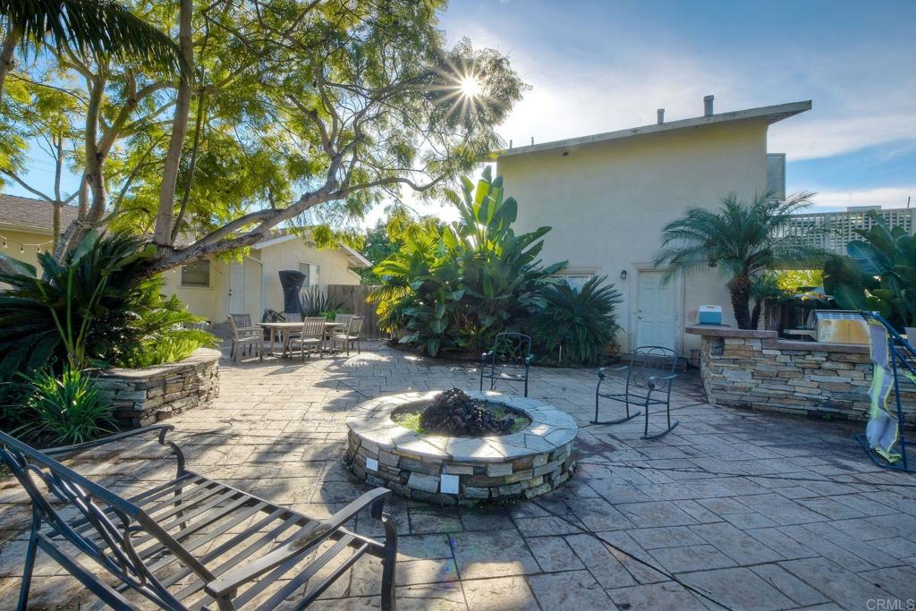 1328 Pine Avenue Carlsbad, CA 92008 - Photo 26 of 48 a view of a backyard with plants and swimming pool