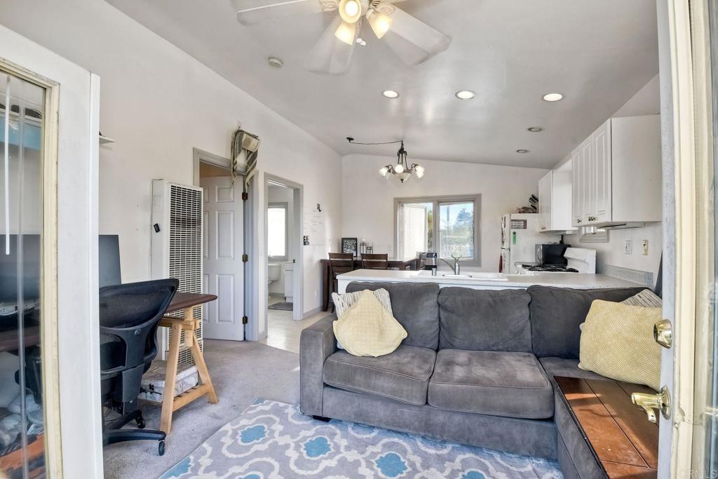 1328 Pine Avenue Carlsbad, CA 92008 - Photo 27 of 48 a living room with furniture and a chandelier