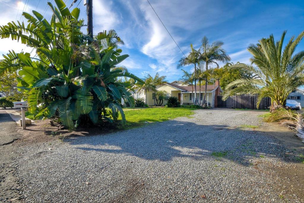 1328 Pine Avenue Carlsbad, CA 92008 - Photo 3 of 48 a view of a yard with a house