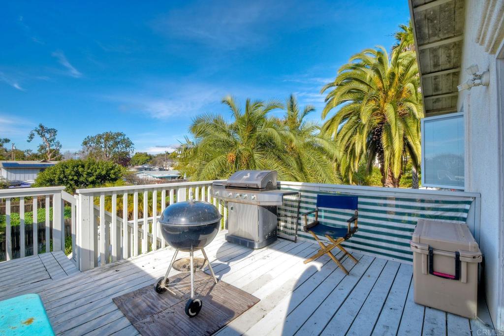 1328 Pine Avenue Carlsbad, CA 92008 - Photo 35 of 48 a view of a chairs and table on the deck