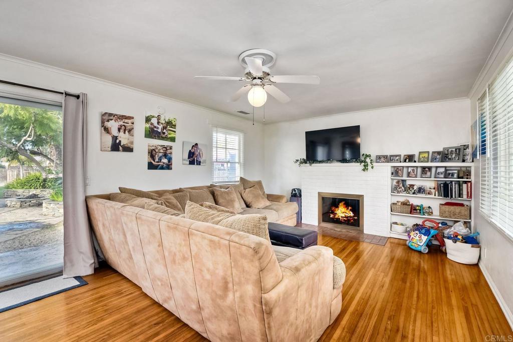 1328 Pine Avenue Carlsbad, CA 92008 - Photo 6 of 48 a living room with furniture and a fireplace