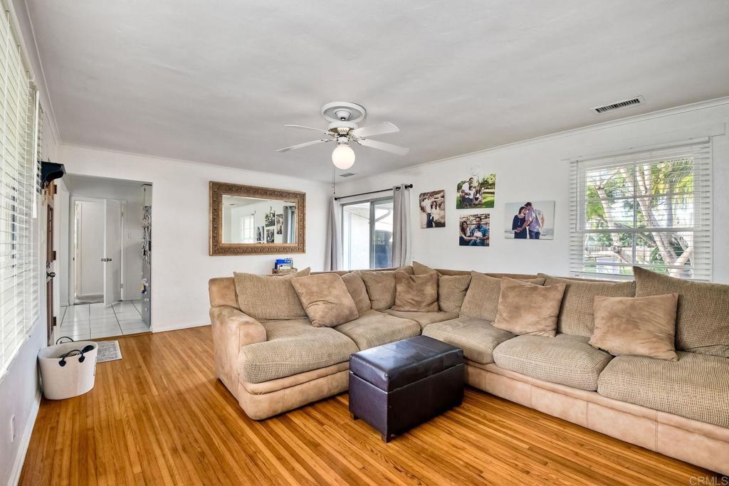 1328 Pine Avenue Carlsbad, CA 92008 - Photo 7 of 48 a living room with furniture and a large window