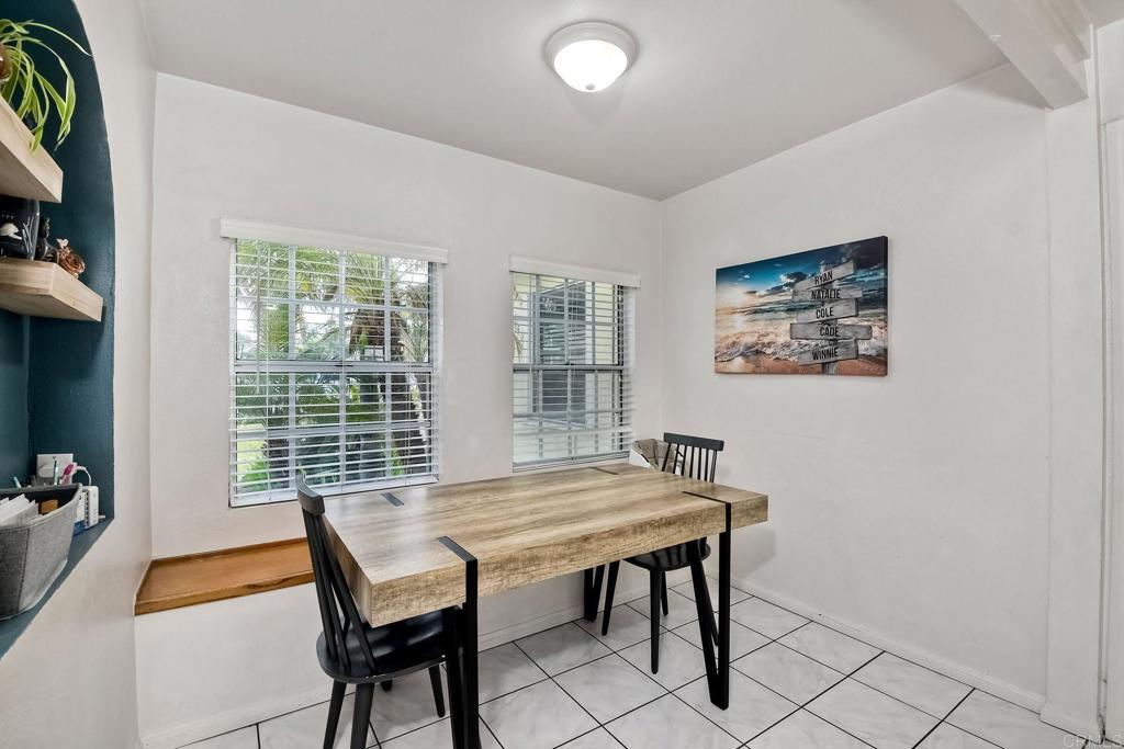1328 Pine Avenue Carlsbad, CA 92008 - Photo 8 of 48 a view of a dining room with furniture and window