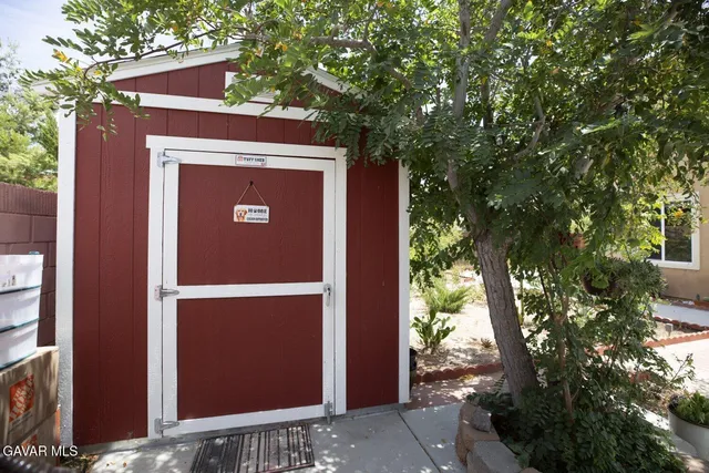 a front view of a house with a yard outdoor seating