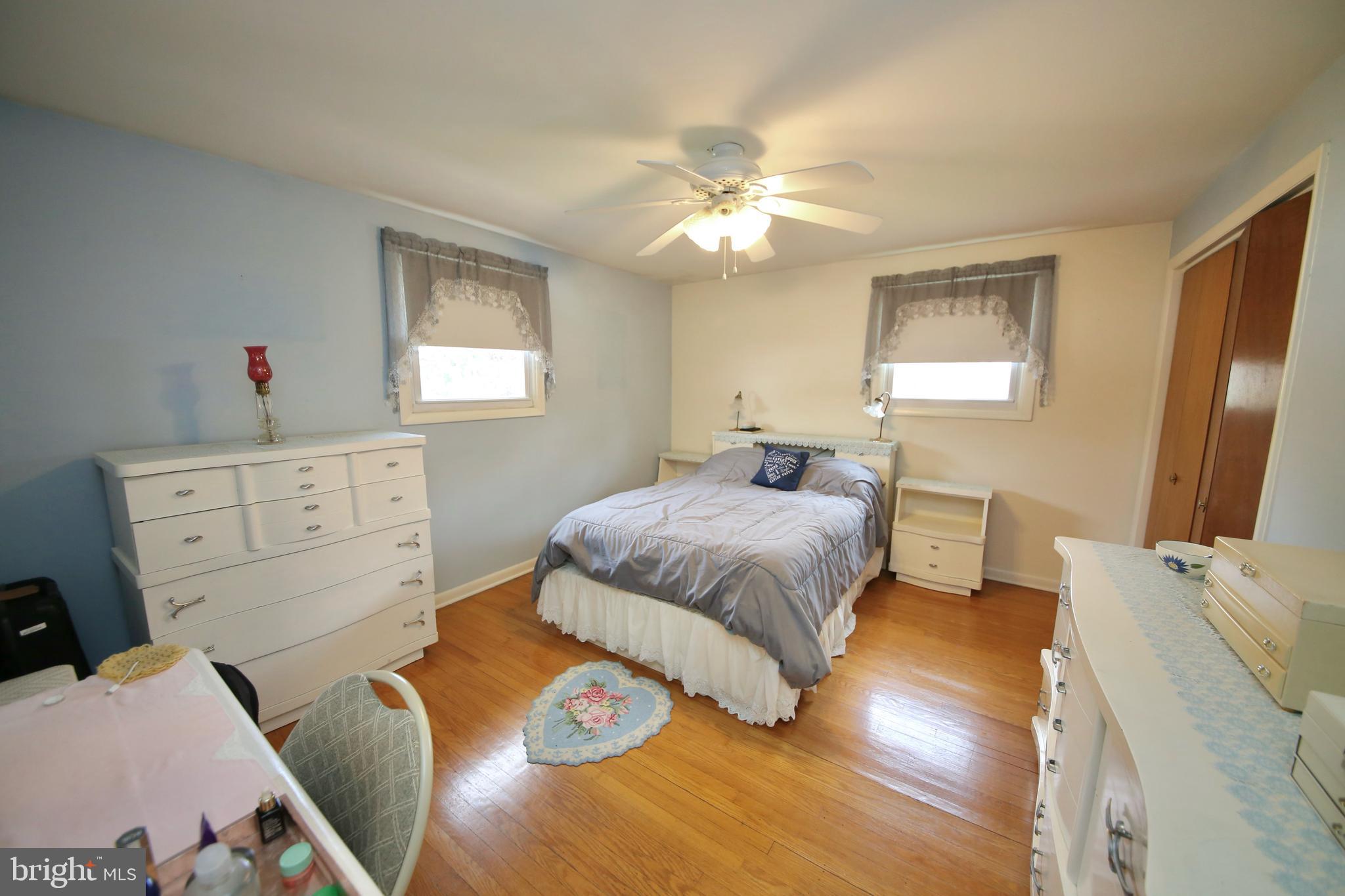 24 Homestead Road Stratford, NJ 08084 - Photo 18 of 39 Main bedroom with hardwood floors and ceiling fan