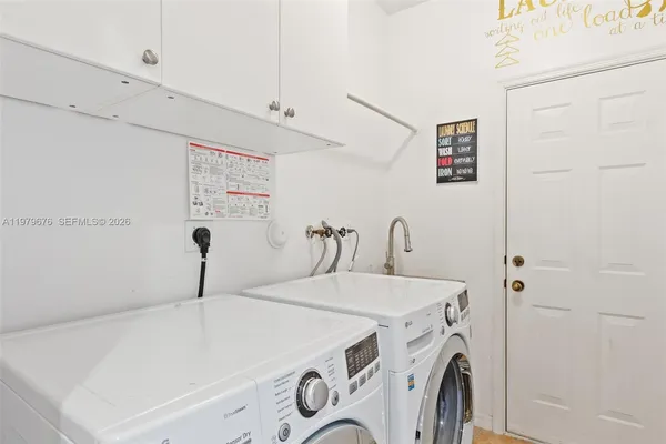 a utility room with dryer and washer
