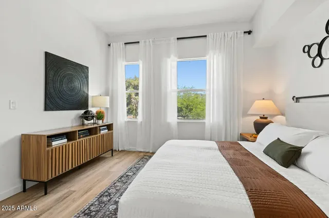a bathroom with double vanity sink and a mirror