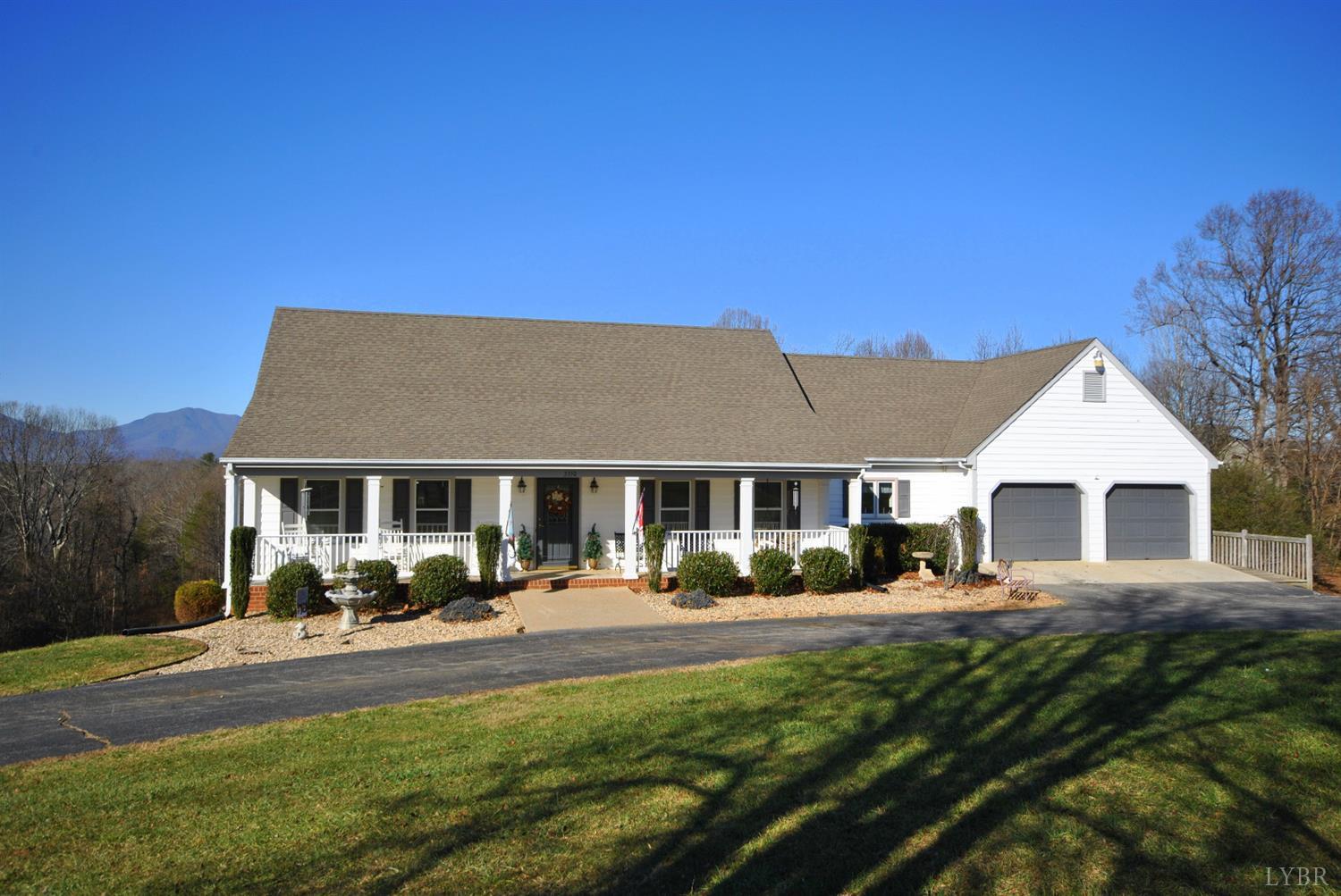3350 Roaring Run Road Goode, VA 24556 - Photo 1 of 90 a front view of a house with a yard table and chairs