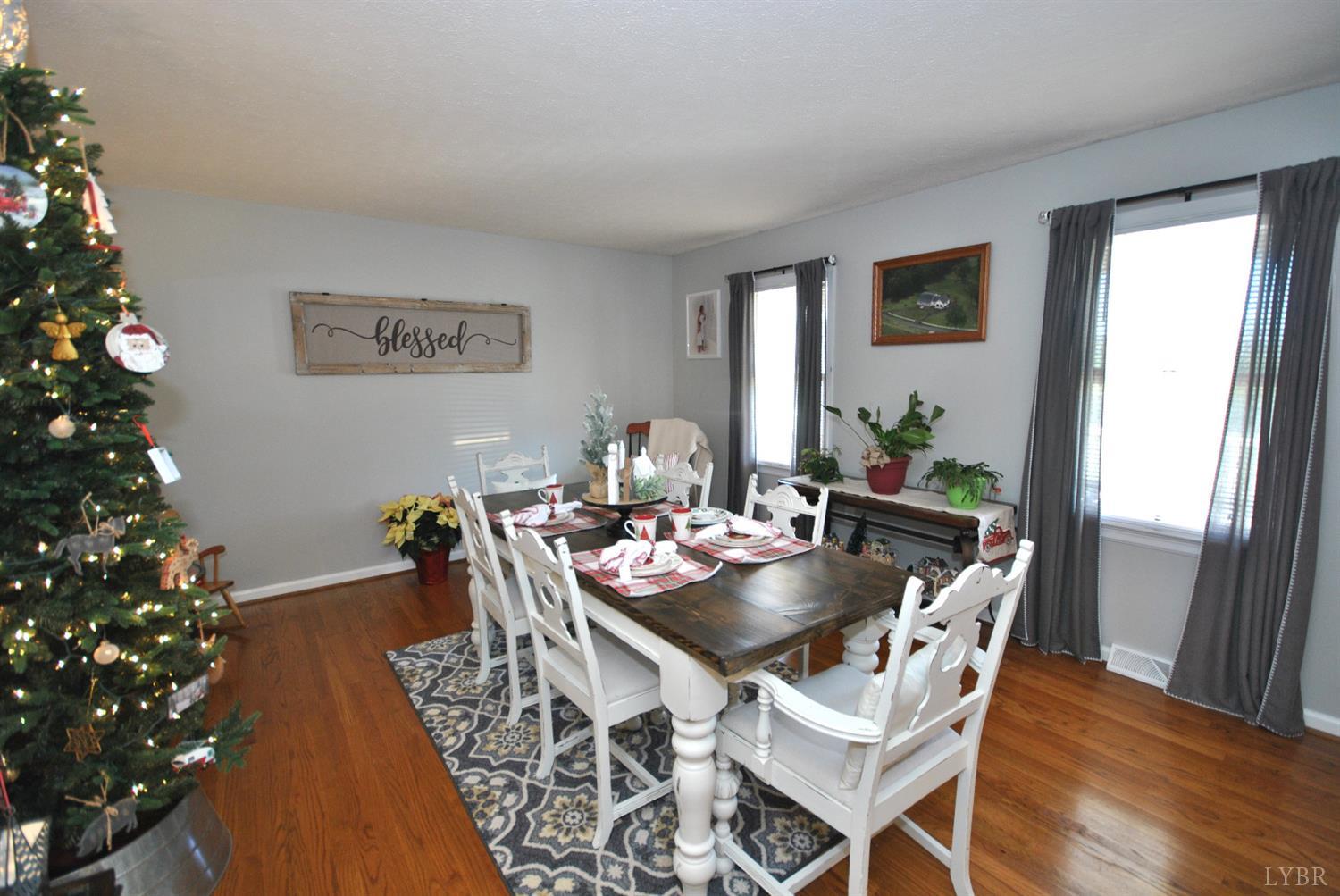 3350 Roaring Run Road Goode, VA 24556 - Photo 18 of 90 a dining room with furniture window and wooden floor