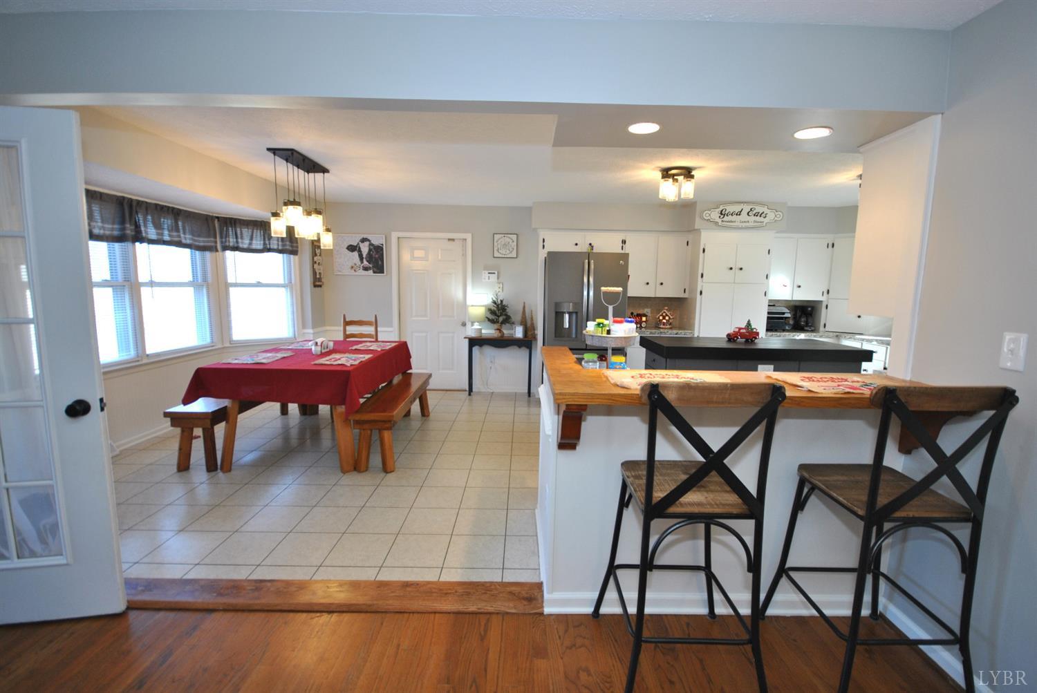 3350 Roaring Run Road Goode, VA 24556 - Photo 22 of 90 a view of a dining room with furniture and chandelier