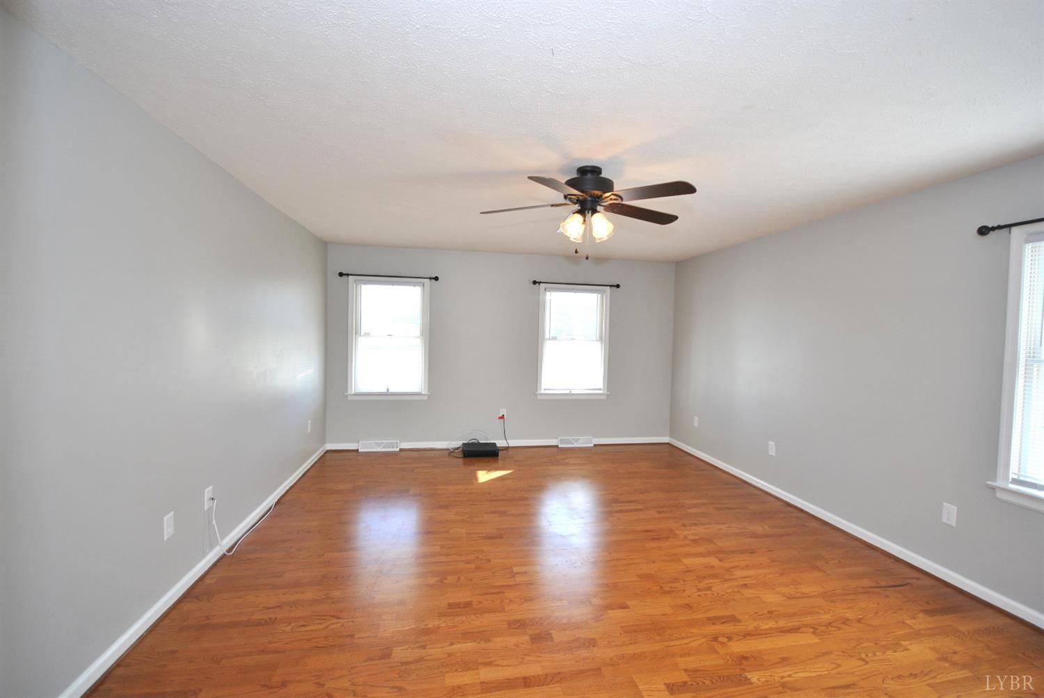 3350 Roaring Run Road Goode, VA 24556 - Photo 42 of 90 wooden floor in an empty room with a window