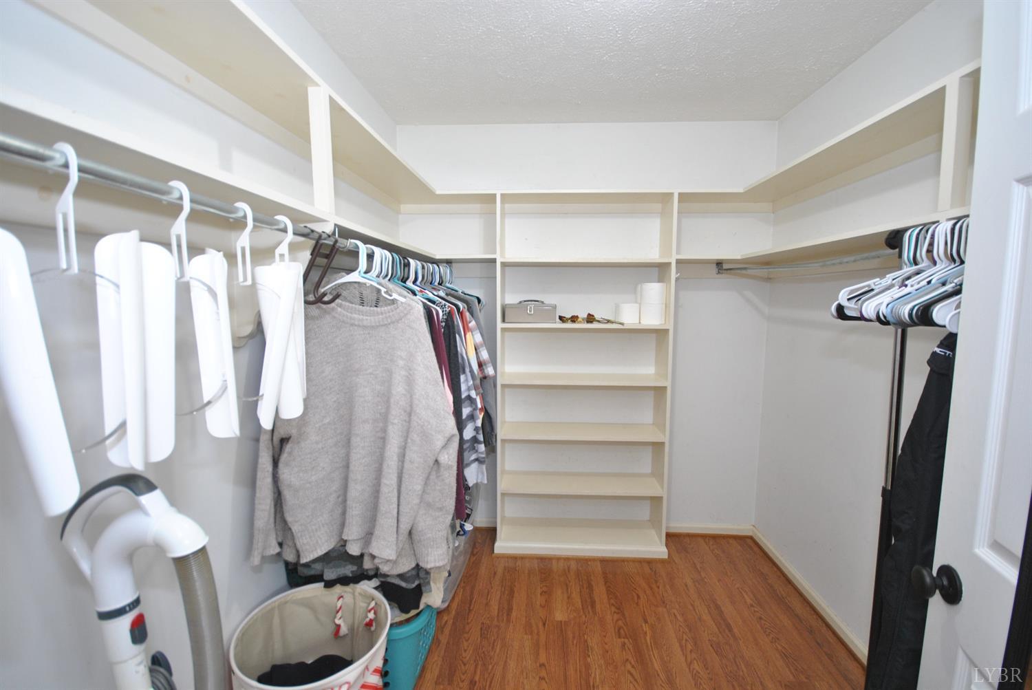 3350 Roaring Run Road Goode, VA 24556 - Photo 44 of 90 a view of walk in closet with clothes and shoes