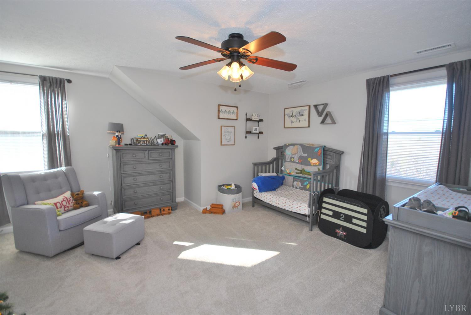 3350 Roaring Run Road Goode, VA 24556 - Photo 46 of 90 a bedroom with furniture and a window