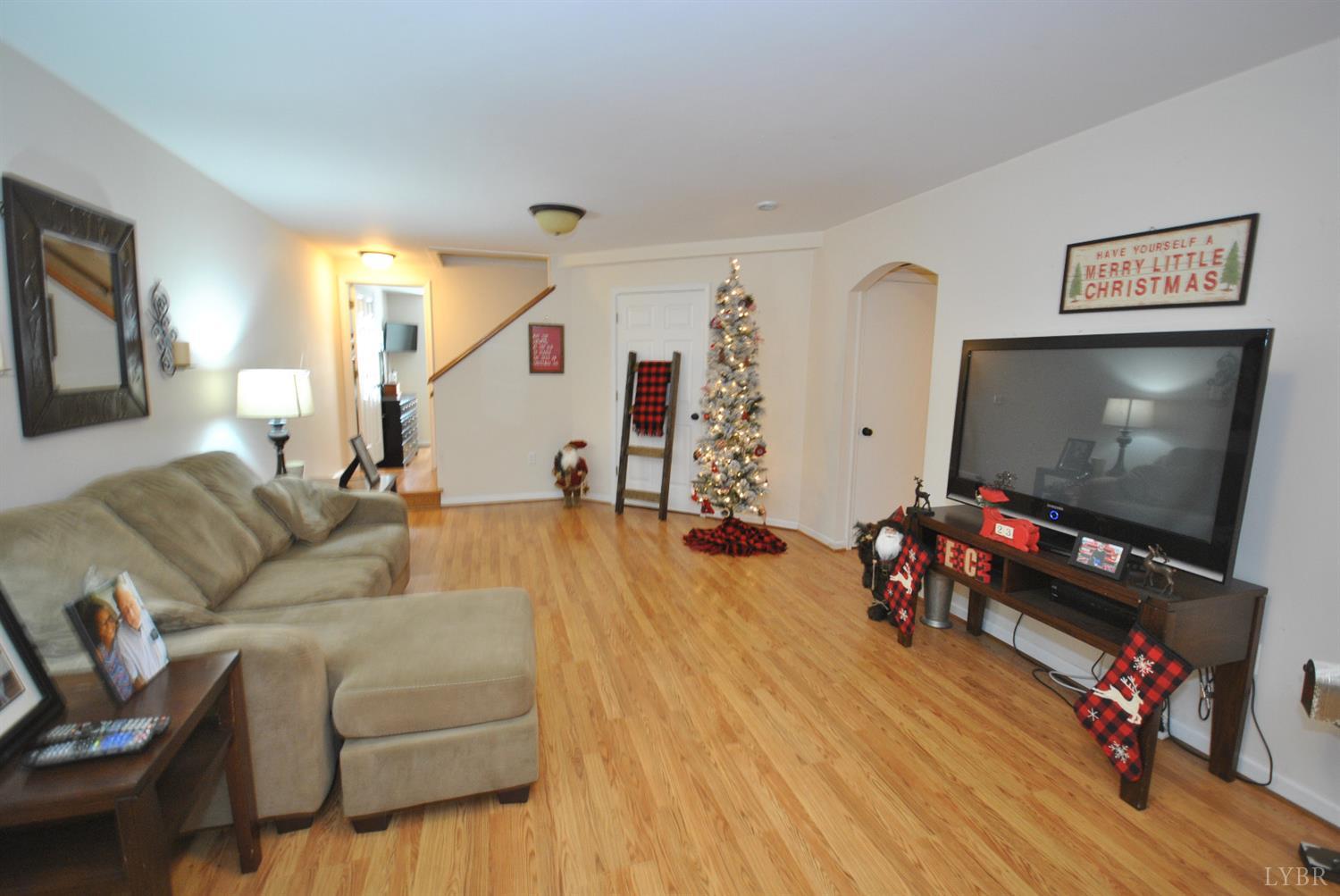 3350 Roaring Run Road Goode, VA 24556 - Photo 57 of 90 a living room with furniture and a flat screen tv