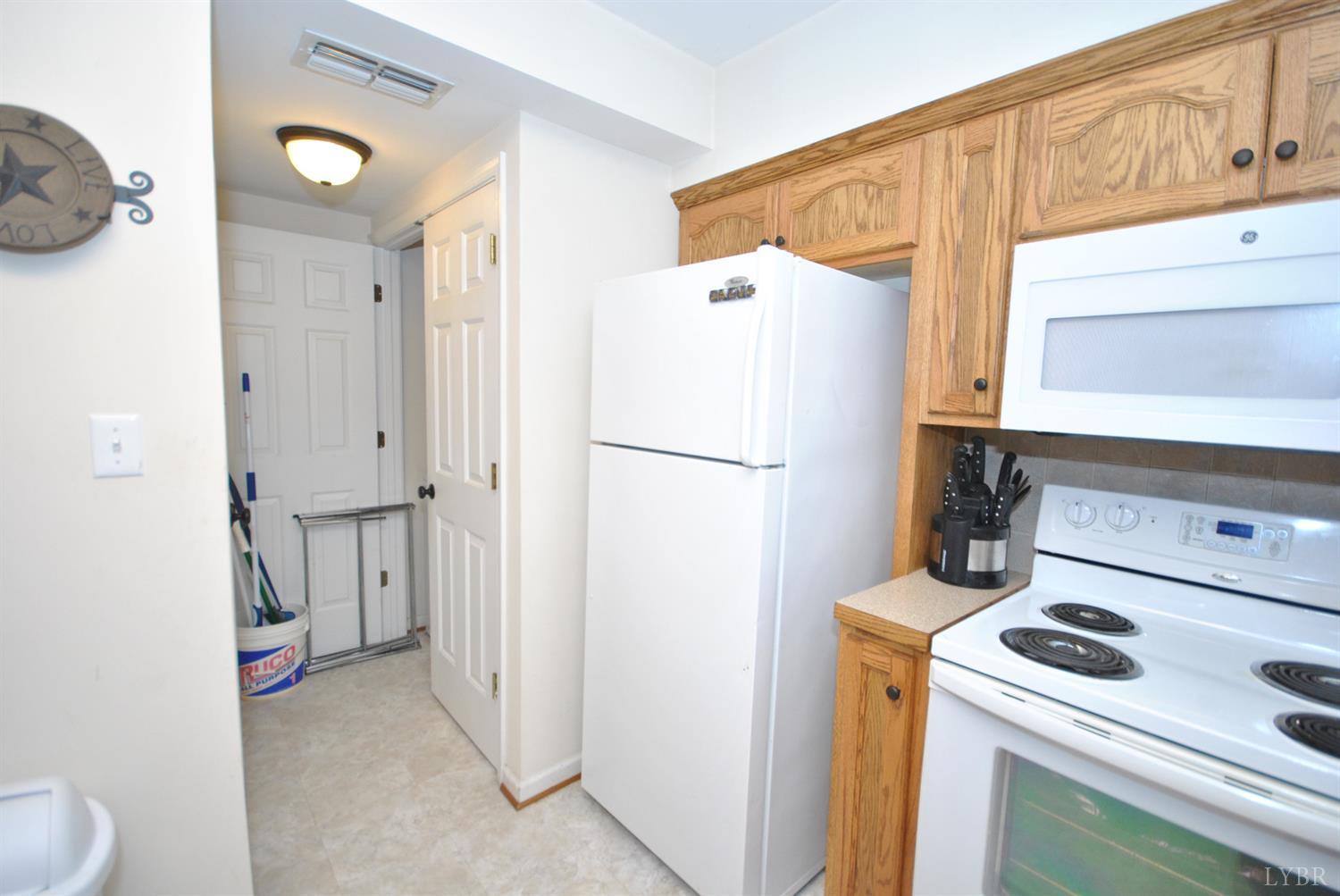 3350 Roaring Run Road Goode, VA 24556 - Photo 60 of 90 a kitchen with a refrigerator and a stove