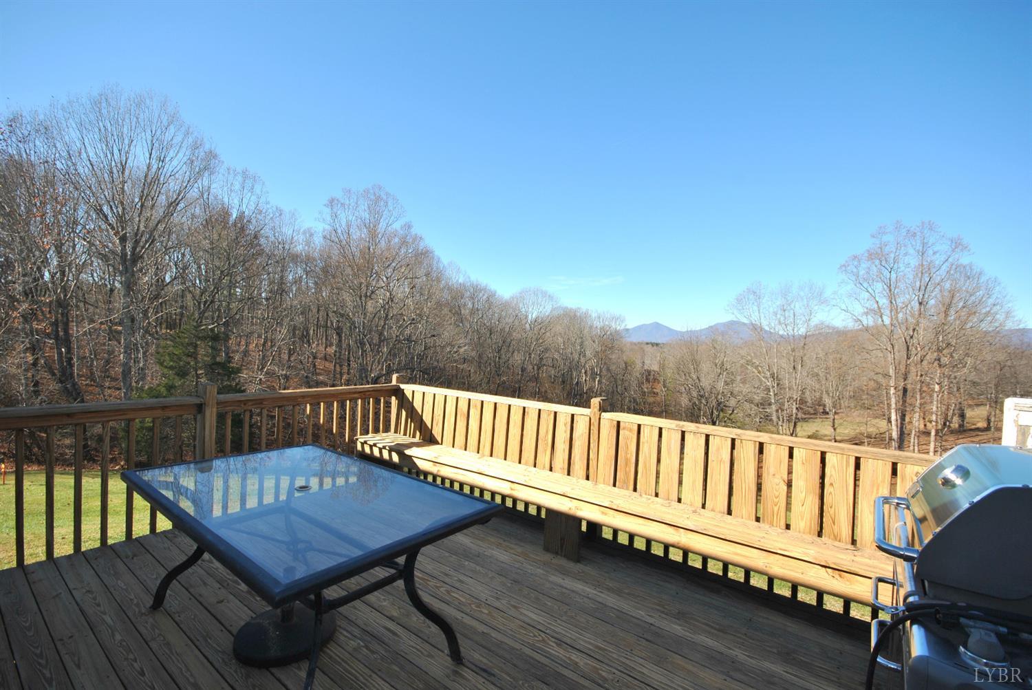 3350 Roaring Run Road Goode, VA 24556 - Photo 69 of 90 a view of a roof deck with wooden floor and fence with a bench