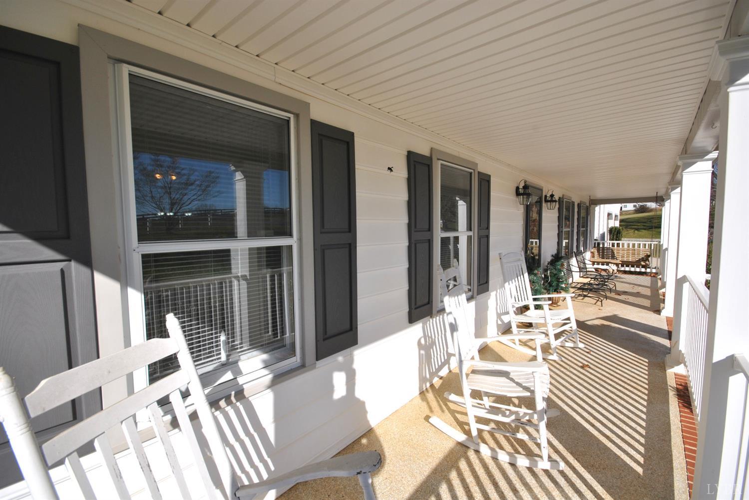 3350 Roaring Run Road Goode, VA 24556 - Photo 10 of 90 a view of a dining room with furniture window and wooden floor