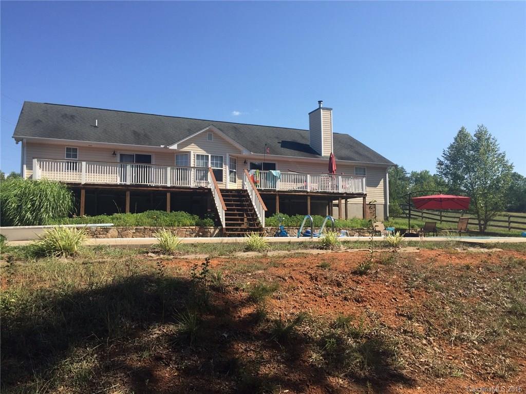 420 Big Level Road Mill Spring, NC 28756 - Photo 2 of 4 a front view of a house with a yard