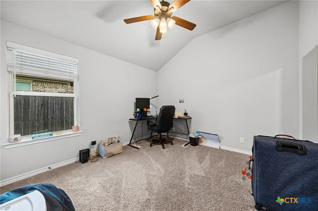 a room with gym equipment and a window