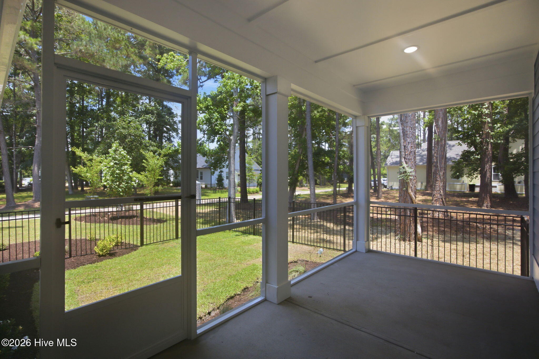 9099 Fountain Street Southwest Calabash, NC 28467 - Photo 23 of 32 Screened Rear Porch