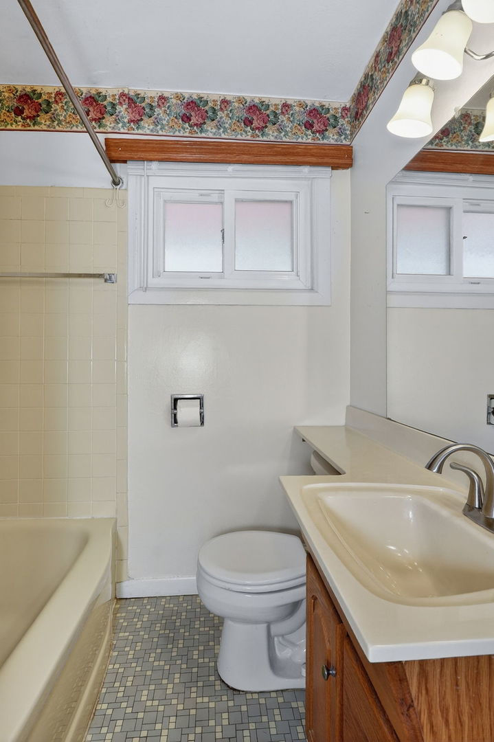 2213 Park Avenue North Riverside, IL 60546 - Photo 11 of 20 a bathroom with a sink a toilet and shower