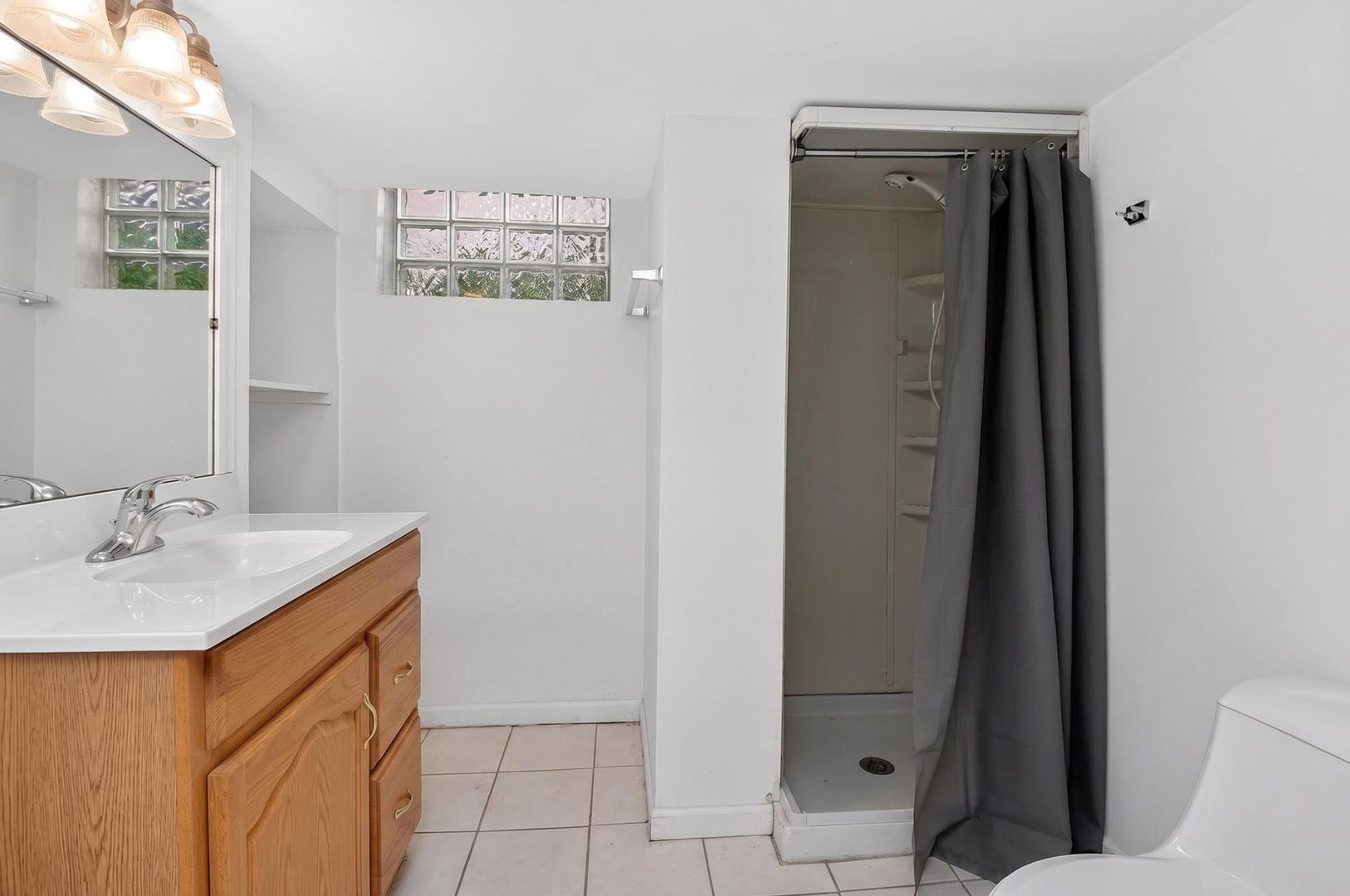 2213 Park Avenue North Riverside, IL 60546 - Photo 14 of 20 a bathroom with a sink a toilet and shower