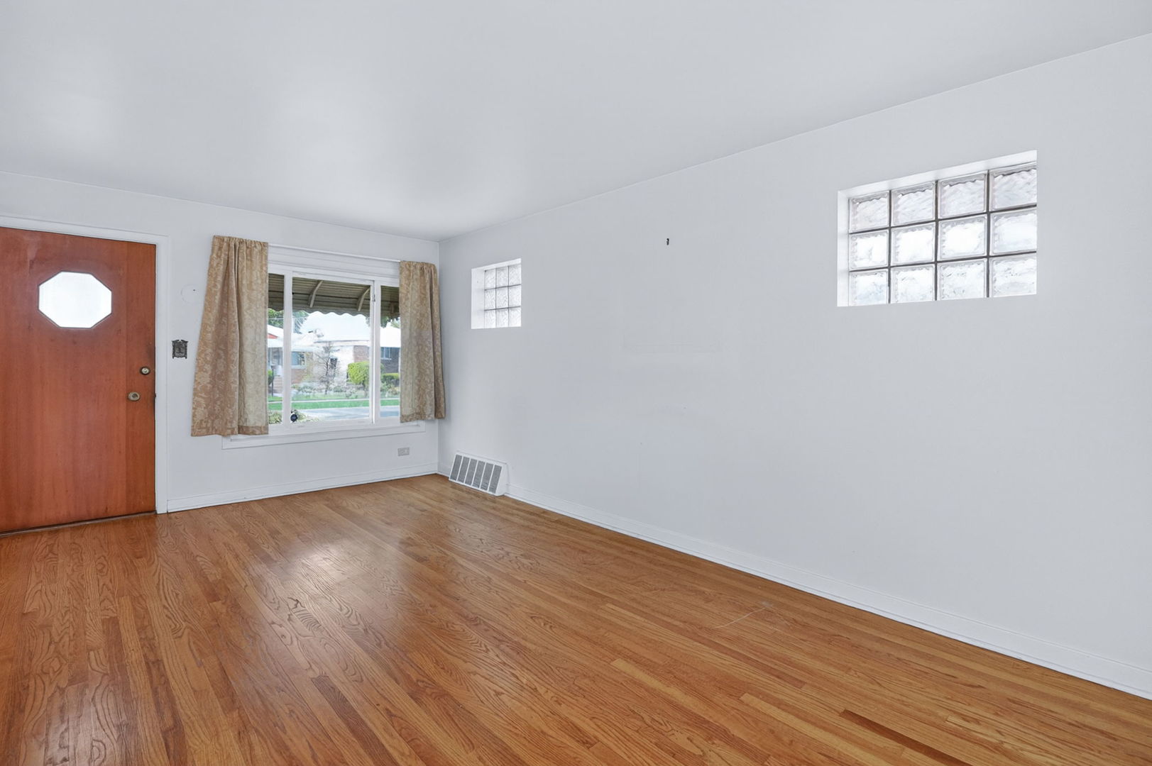 2213 Park Avenue North Riverside, IL 60546 - Photo 3 of 20 an empty room with wooden floor and windows
