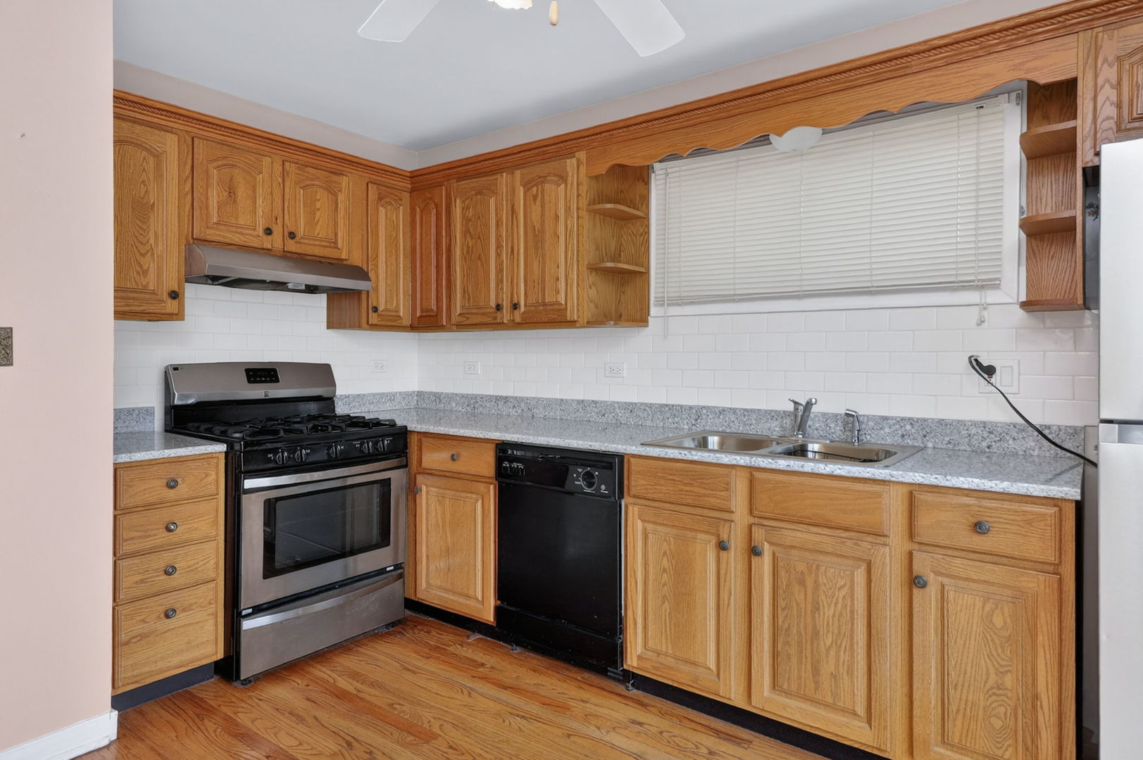 2213 Park Avenue North Riverside, IL 60546 - Photo 8 of 20 a kitchen with granite countertop a sink cabinets and stainless steel appliances