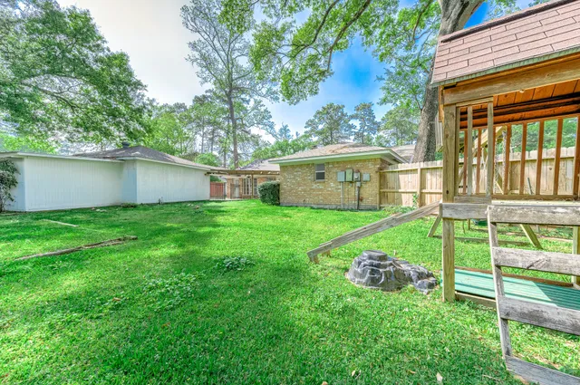 a house view with a backyard space