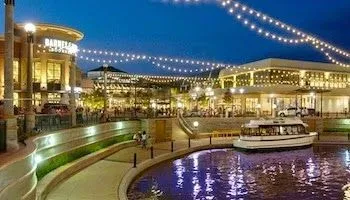 a view of a swimming pool and an outdoor seating