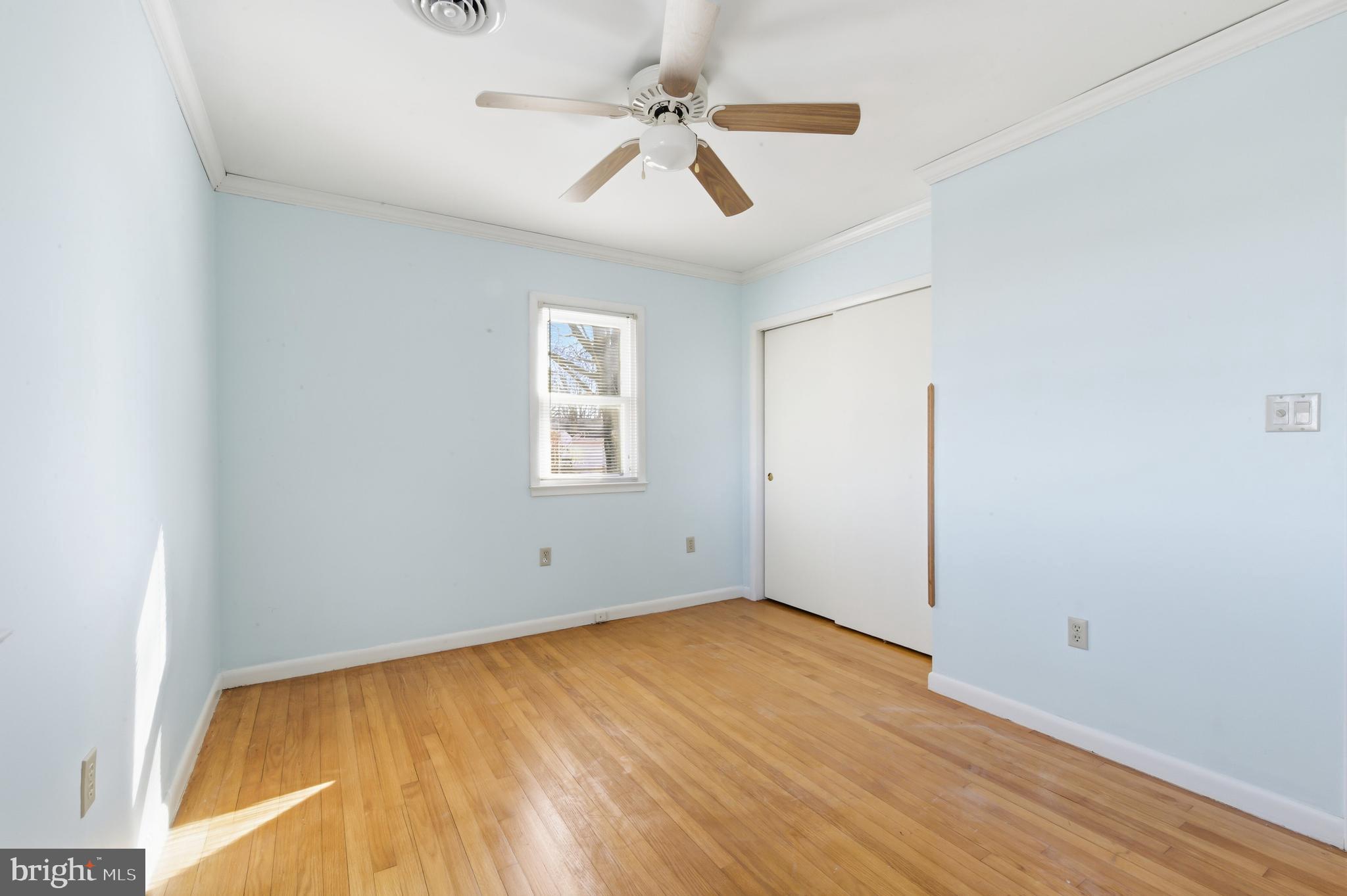 24339 Chestertown Road Chestertown, MD 21620 - Photo 18 of 35 an empty room with windows and fan