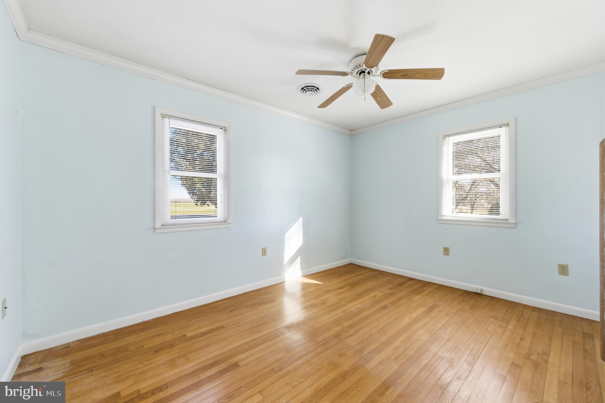 24339 Chestertown Road Chestertown, MD 21620 - Photo 19 of 35 a view of room with wooden floor ceiling fan and window