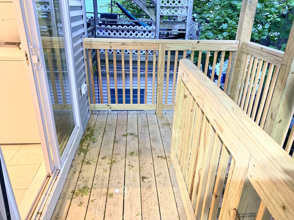130 West 8th Street, Unit 3 Boston, MA 02127 - Photo 22 of 32 a view of balcony with wooden floor