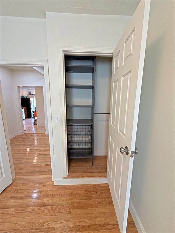 130 West 8th Street, Unit 3 Boston, MA 02127 - Photo 7 of 32 a view of a hallway view with wooden floor and staircase