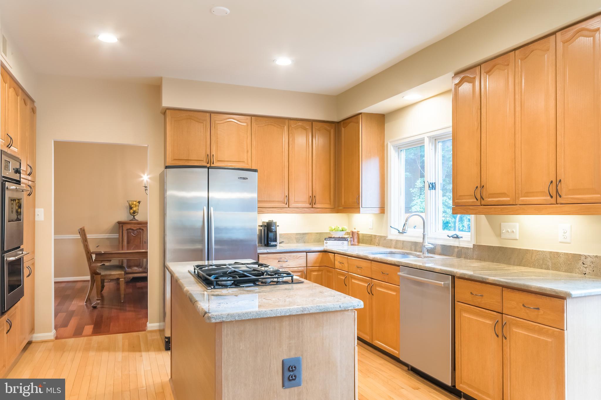 8156 Ridge Creek Way Springfield, VA 22153 - Photo 14 of 57 Open, light-filled kitchen w/ center island