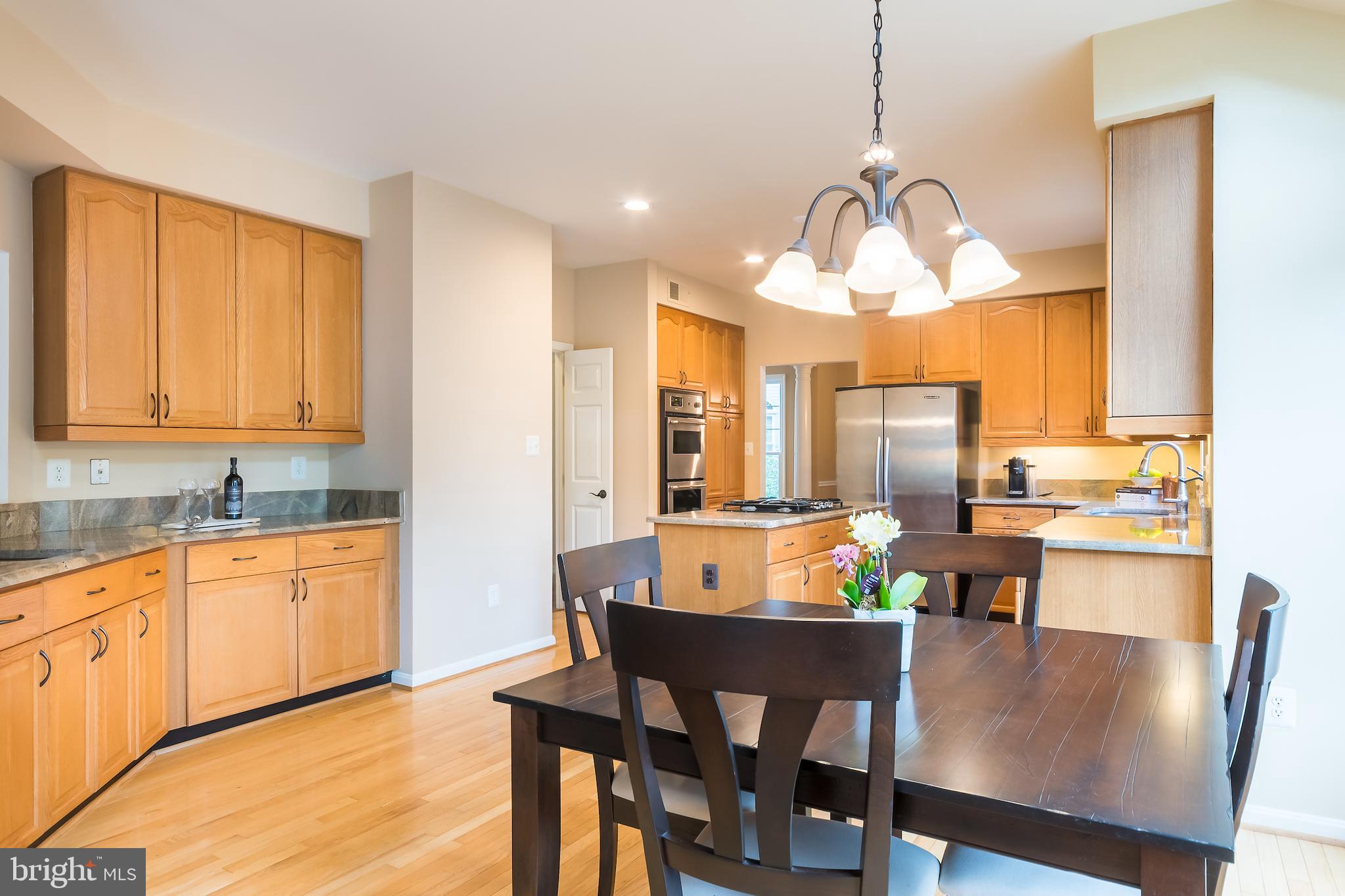 8156 Ridge Creek Way Springfield, VA 22153 - Photo 17 of 57 Kitchen w/ extended countertops & cabinets