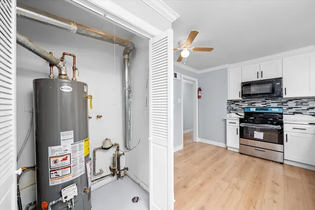 a kitchen with stainless steel appliances a stove a microwave and a refrigerator