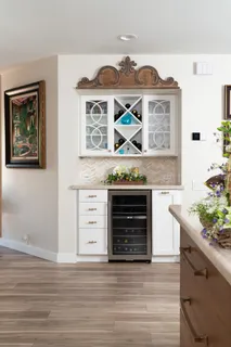 a kitchen with stainless steel appliances granite countertop a stove and a wooden floor