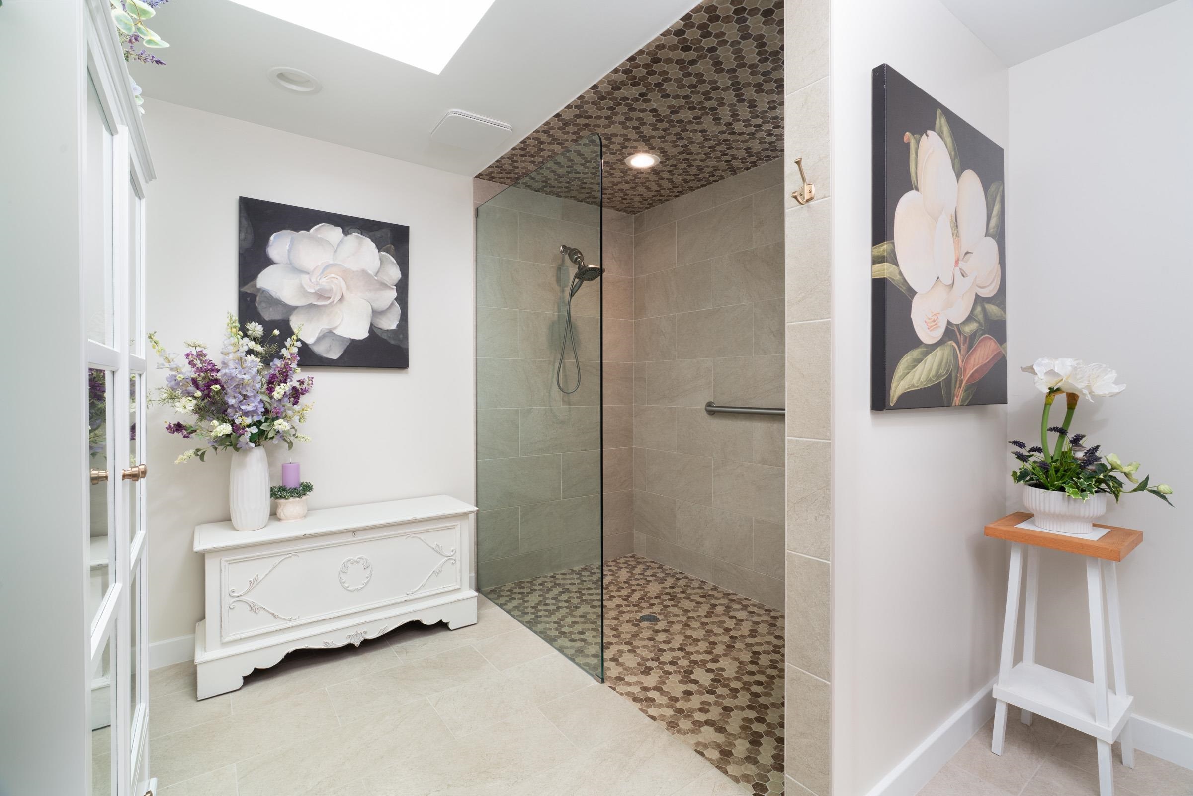 50 Puu Anoano Street, Unit 2804 Lahaina, HI 96761 - Photo 28 of 49 a bathroom with a sink mirror and shower