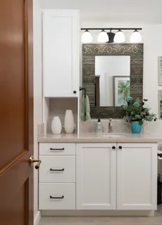 a bathroom with a toilet a sink and shower